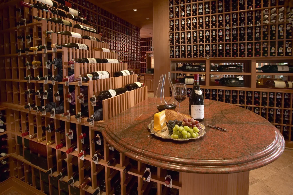 wine cellar with bottle and glasses on table